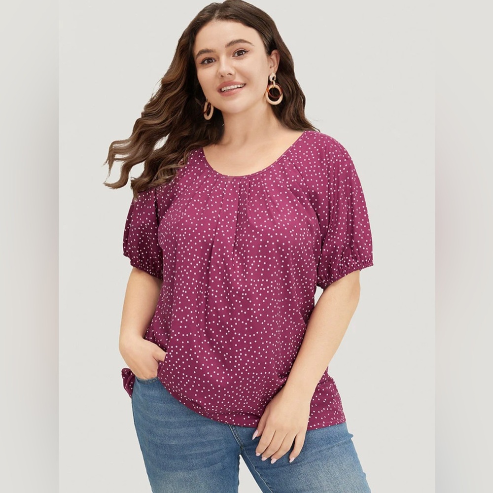 Polka dot round neck, puff sleeve blouse.